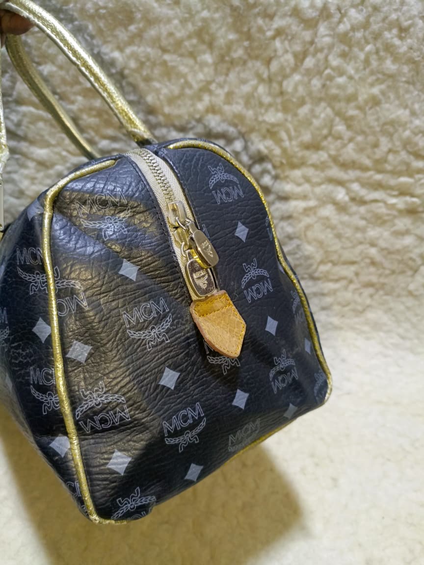 MCM Visetos Princess Lion Boston Bag – Black/Gold | Pre-Loved