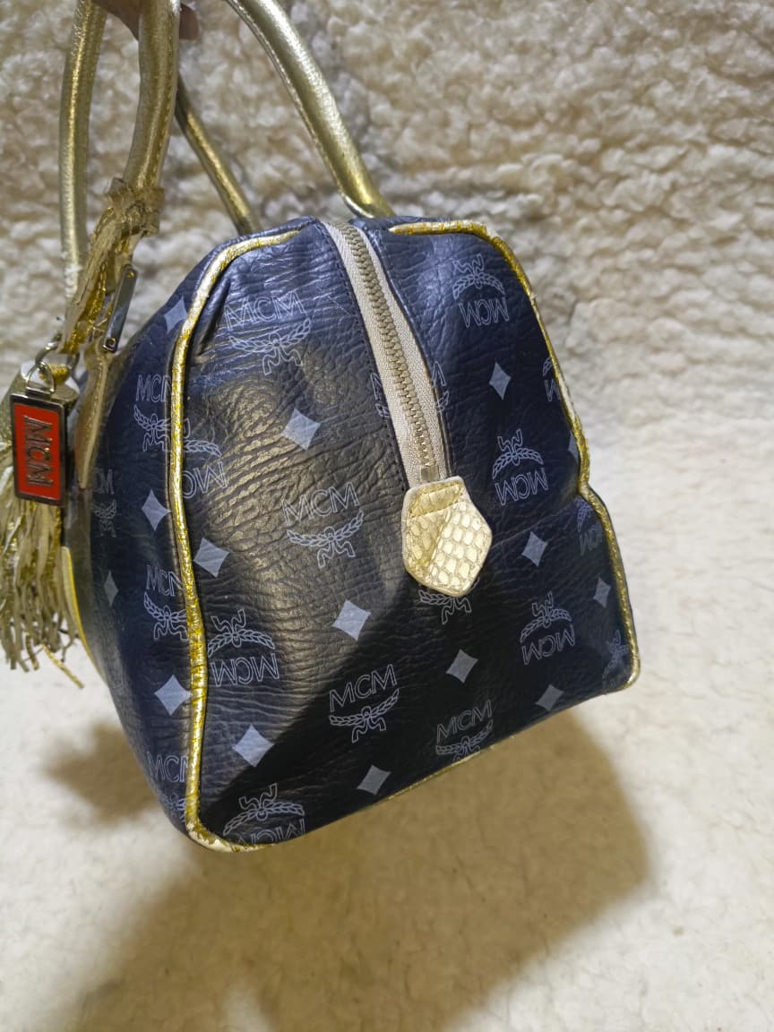 MCM Visetos Princess Lion Boston Bag – Black/Gold | Pre-Loved