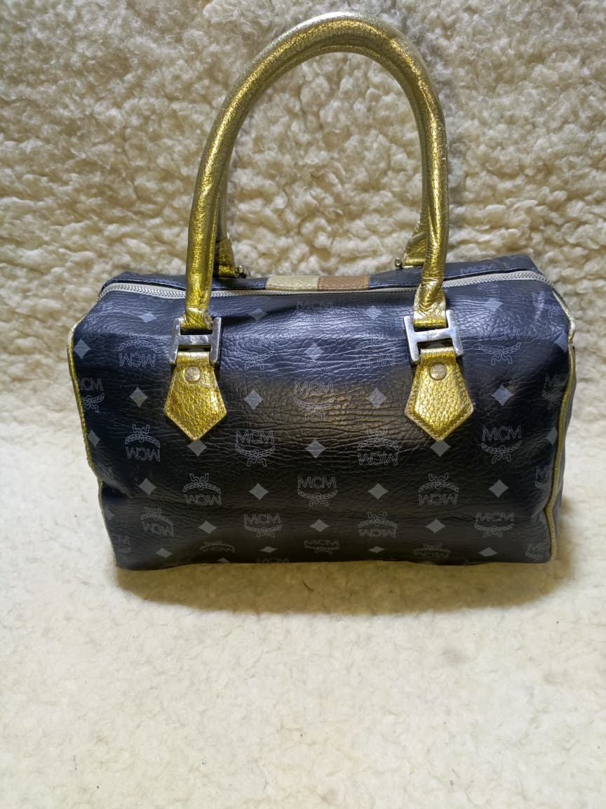 MCM Visetos Princess Lion Boston Bag – Black/Gold | Pre-Loved