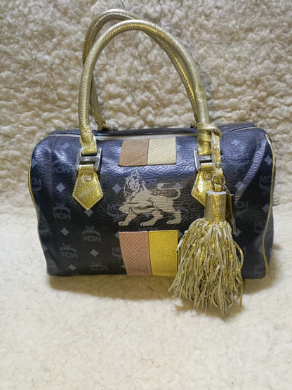 MCM Visetos Princess Lion Boston Bag – Black/Gold | Pre-Loved