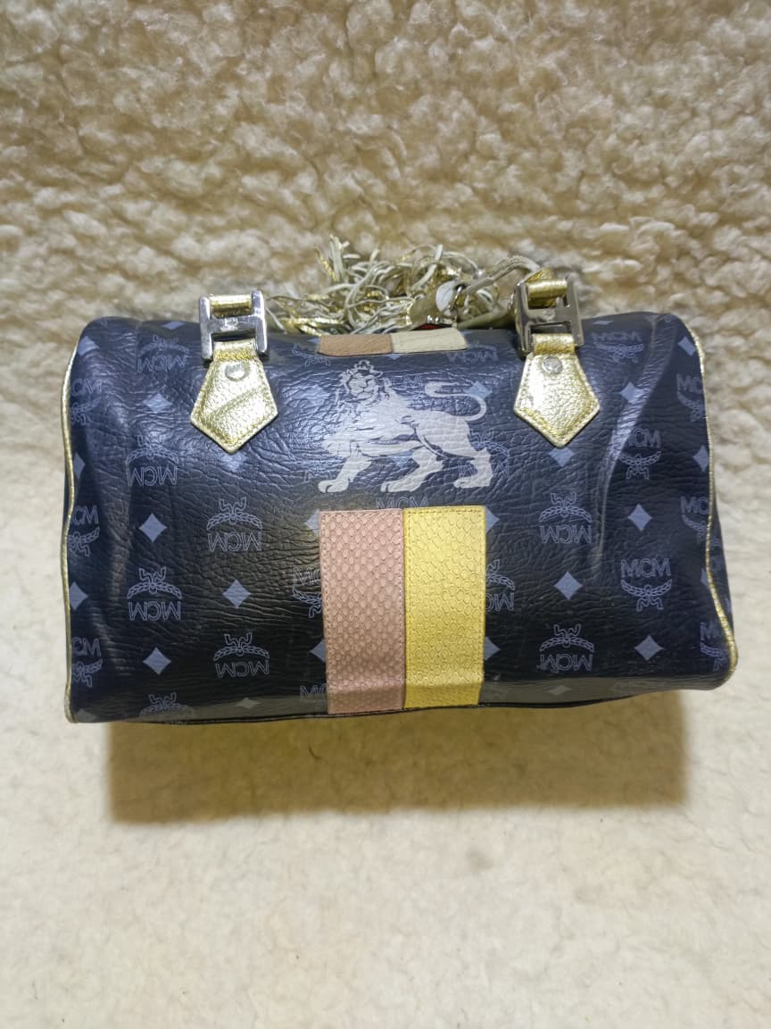 MCM Visetos Princess Lion Boston Bag – Black/Gold | Pre-Loved