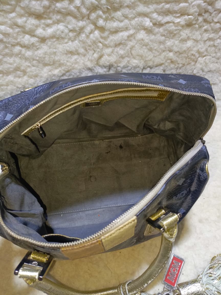 MCM Visetos Princess Lion Boston Bag – Black/Gold | Pre-Loved